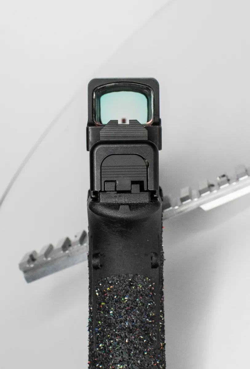 How to clean red dot sights with cleaning solution and compressed air for optimal clarity.